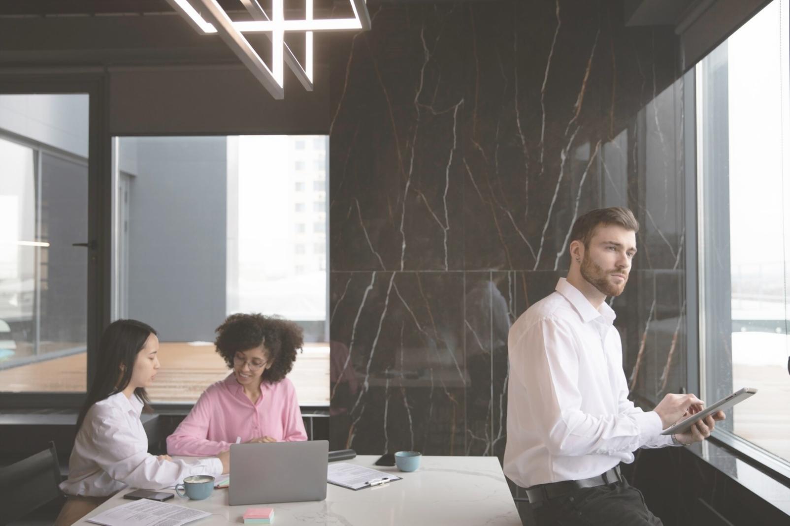 Finance professional presenting liquidity analysis charts to business team in modern office